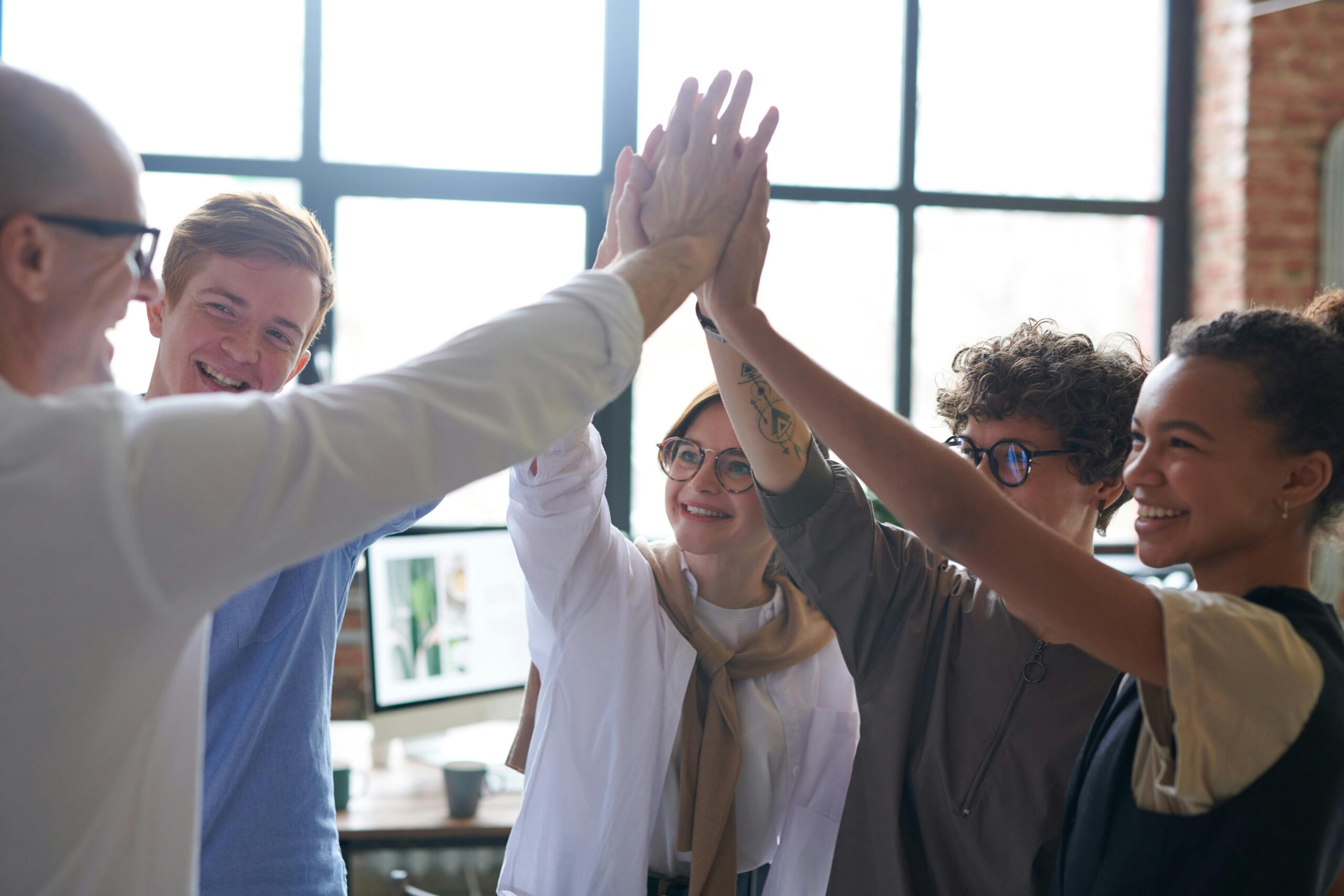 people-high-fiving-happy